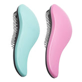 WYNK Detangling Brush close-up showing bristles easing knots without pulling on thick hair