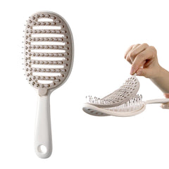 Xinqirity self-cleaning hair brush pad removal for quick cleanup after styling.