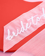 ivory organza bow as a versatile bachelorette party accessory on a mirror display