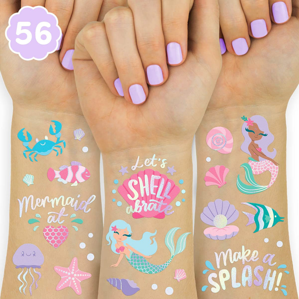 xo, Fetti under the sea mermaid foil tattoo designs applied on skin for a sparkling party look