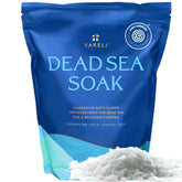 Yareli magnesium flakes in a Dead Sea bath setup promoting relaxation.