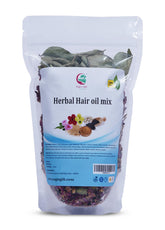 Yogi’s Gift Herbal Hair Oil Mix ingredients laid out for scalp nourishment.