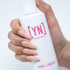 Young Nails liquid monomer application pour demonstrates smooth self-leveling for perfect acrylics