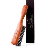 ZilberHaar beard brush with stiff boar bristles for thorough cleansing.