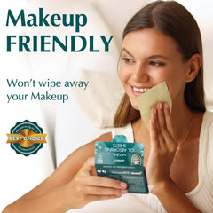 Hands holding blotting sheet to absorb oil without disturbing makeup