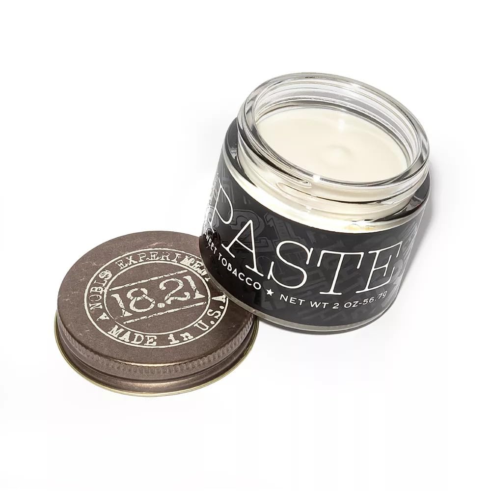 18-21 Man Made hair paste jar closeup shows creamy texture for shaping.