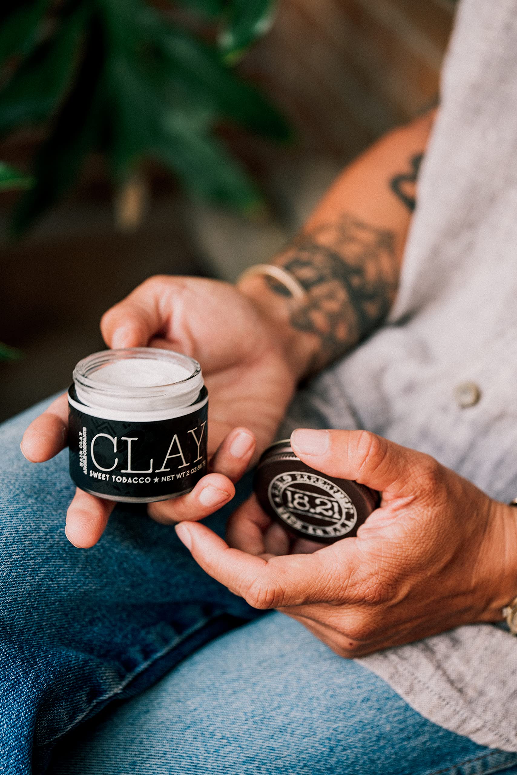Premium packaging of 18.21 Man Made hair clay.