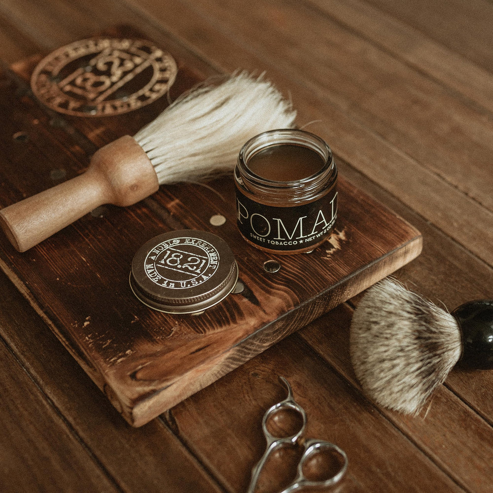 Styling short hair using 18.21 Man Made pomade for a sleek look