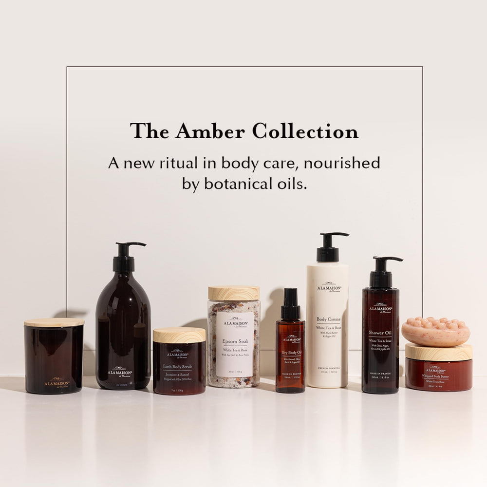 A LA MAISON packaging in amber glass with 50% recycled plastic, eco-friendly choice.