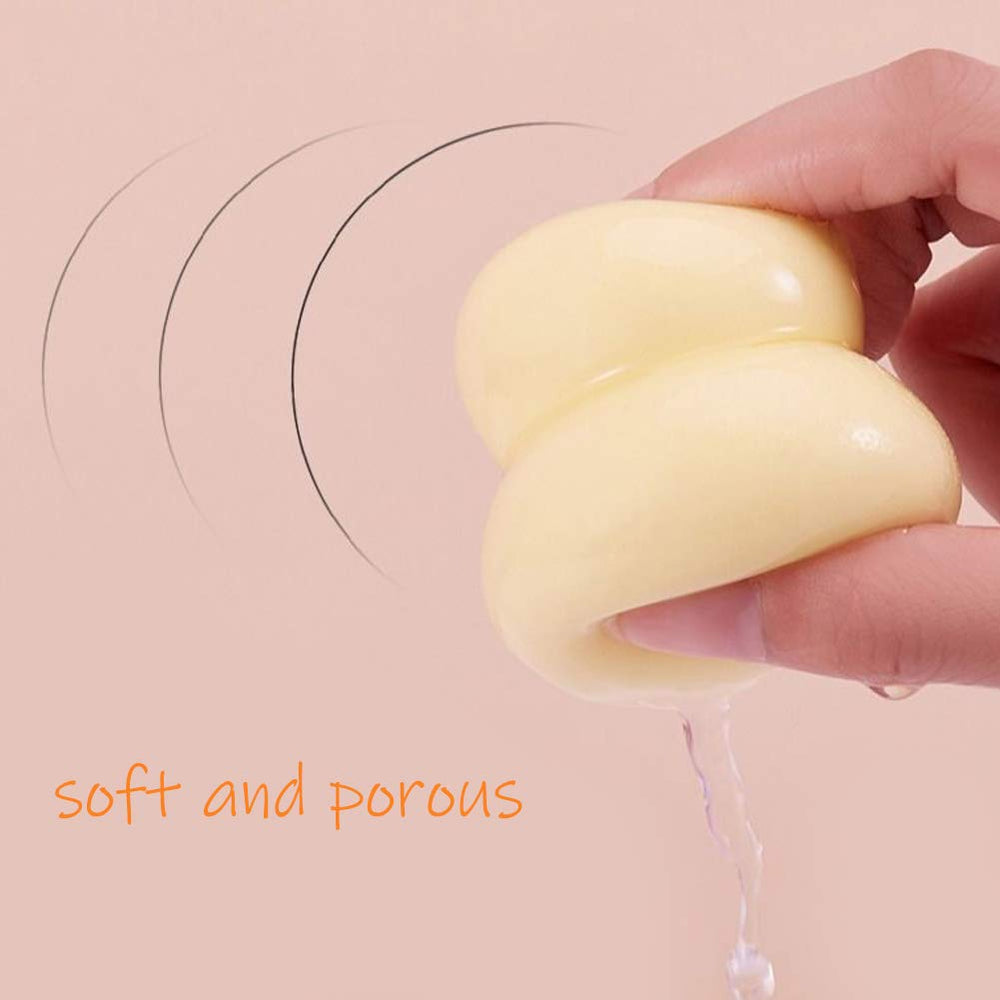 Abgream olive-shaped flat-edge sponge with rose gold accent for seamless blending.