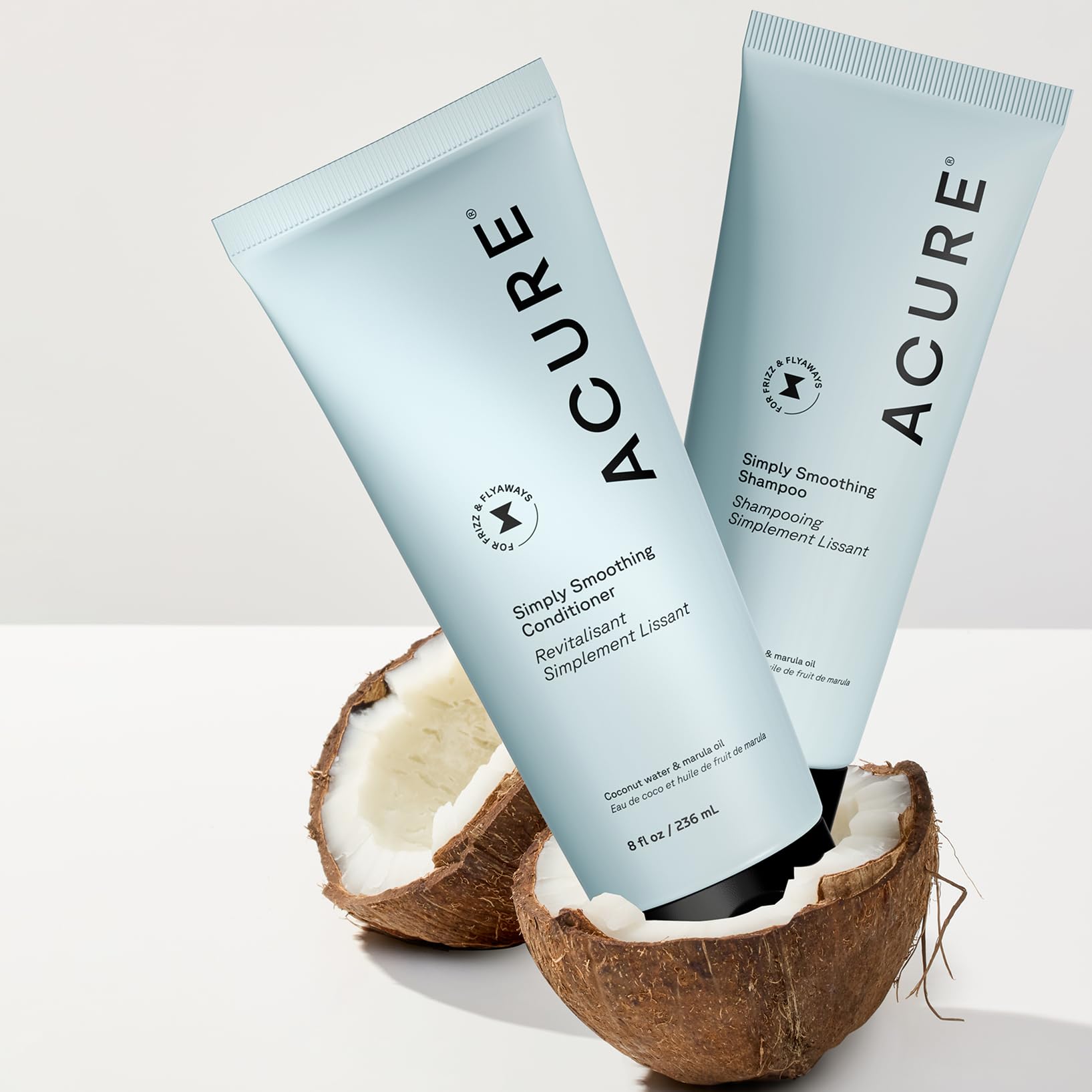 Acure Simply Smoothing Conditioner cream texture demonstrates easy detangling.