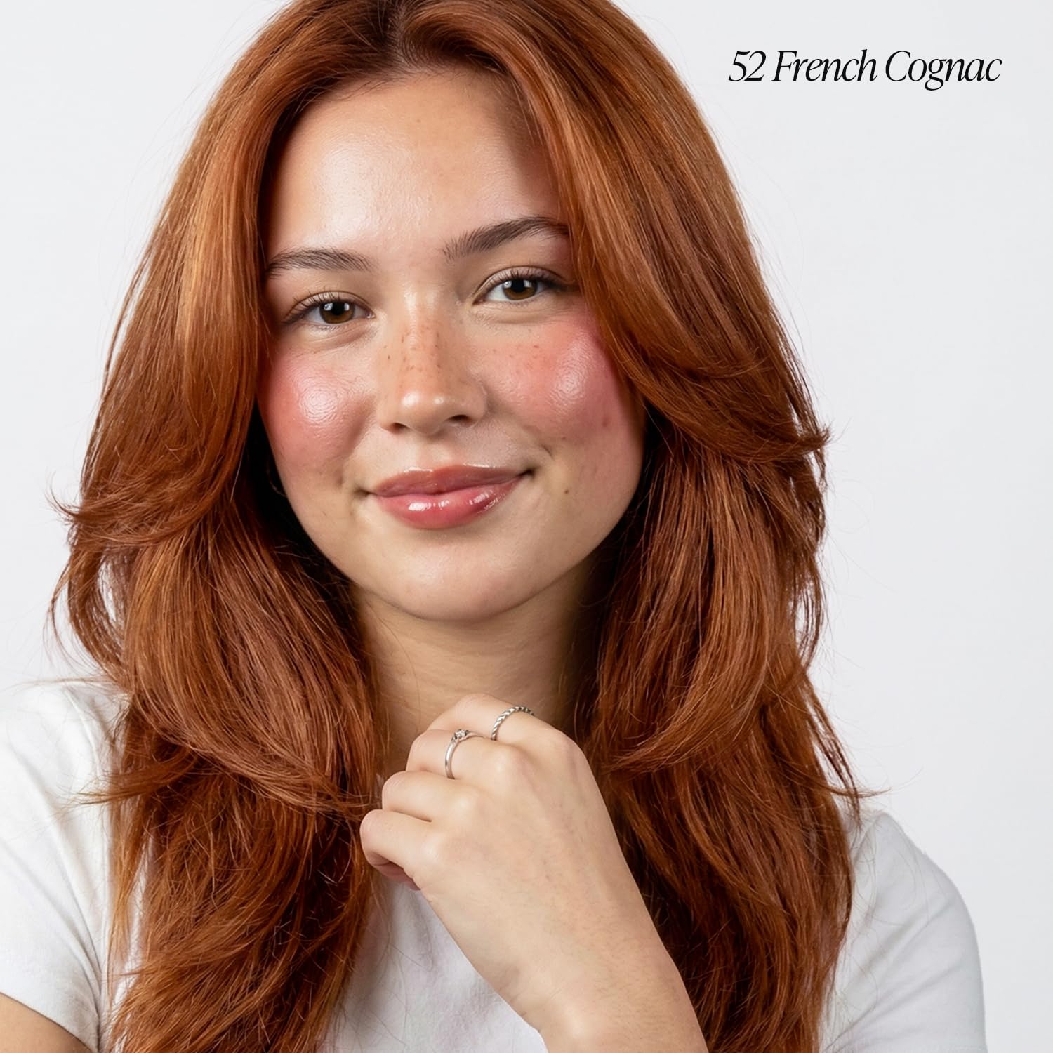 Close-up of Adore 052 French Cognac cap highlighting premium packaging and color deposit.