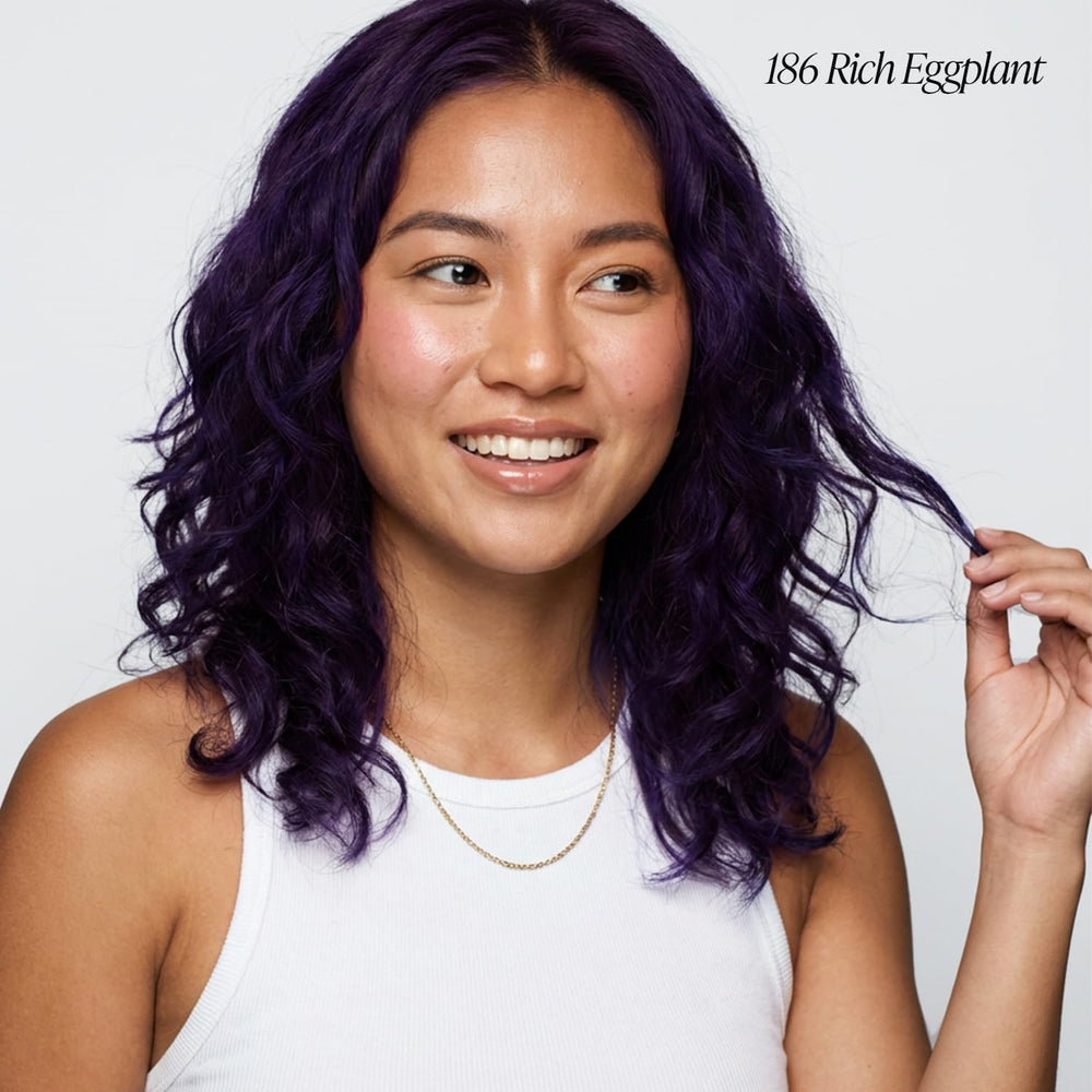 Adore Rich Eggplant swatch on hair showing deep, vibrant purple shade