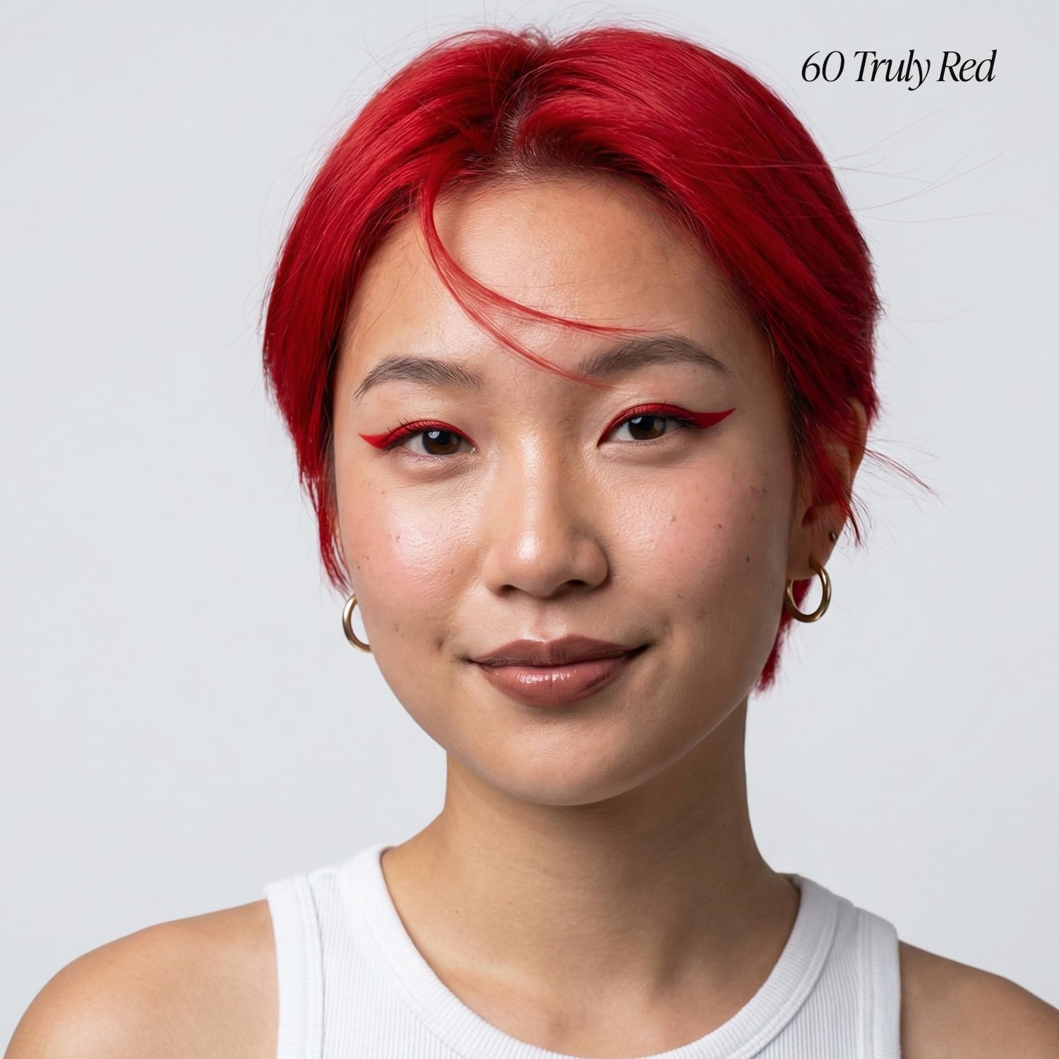Adore Truly Red color texture closeup highlights rich pigment for at-home results.