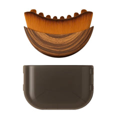 AEKI Lymphatic Contour Face Brush close-up reveals soft bristles for gentle facial massage.