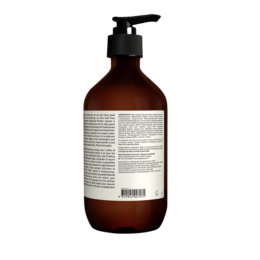 Aesop conditioner in shower setup illustrates easy daily hair care.