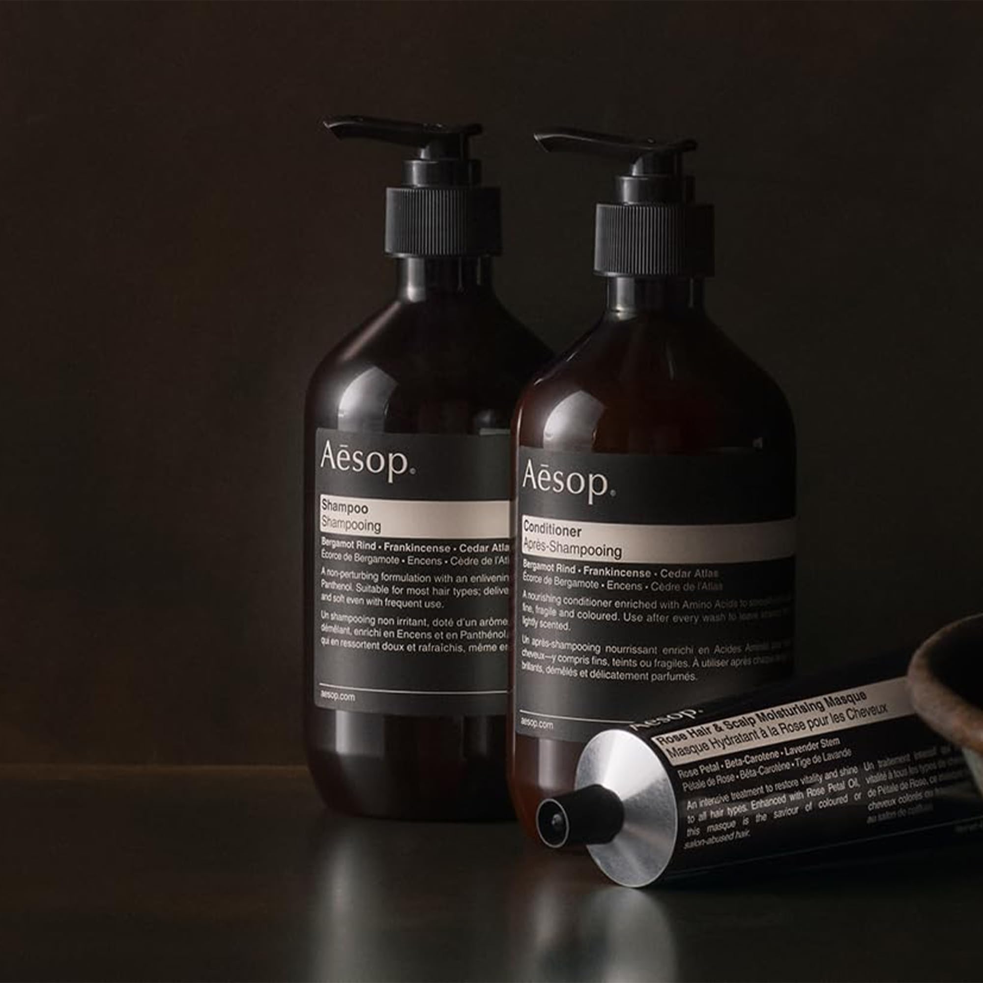 Aesop conditioner packaging closeup highlights recycled bottle and vegan formula.