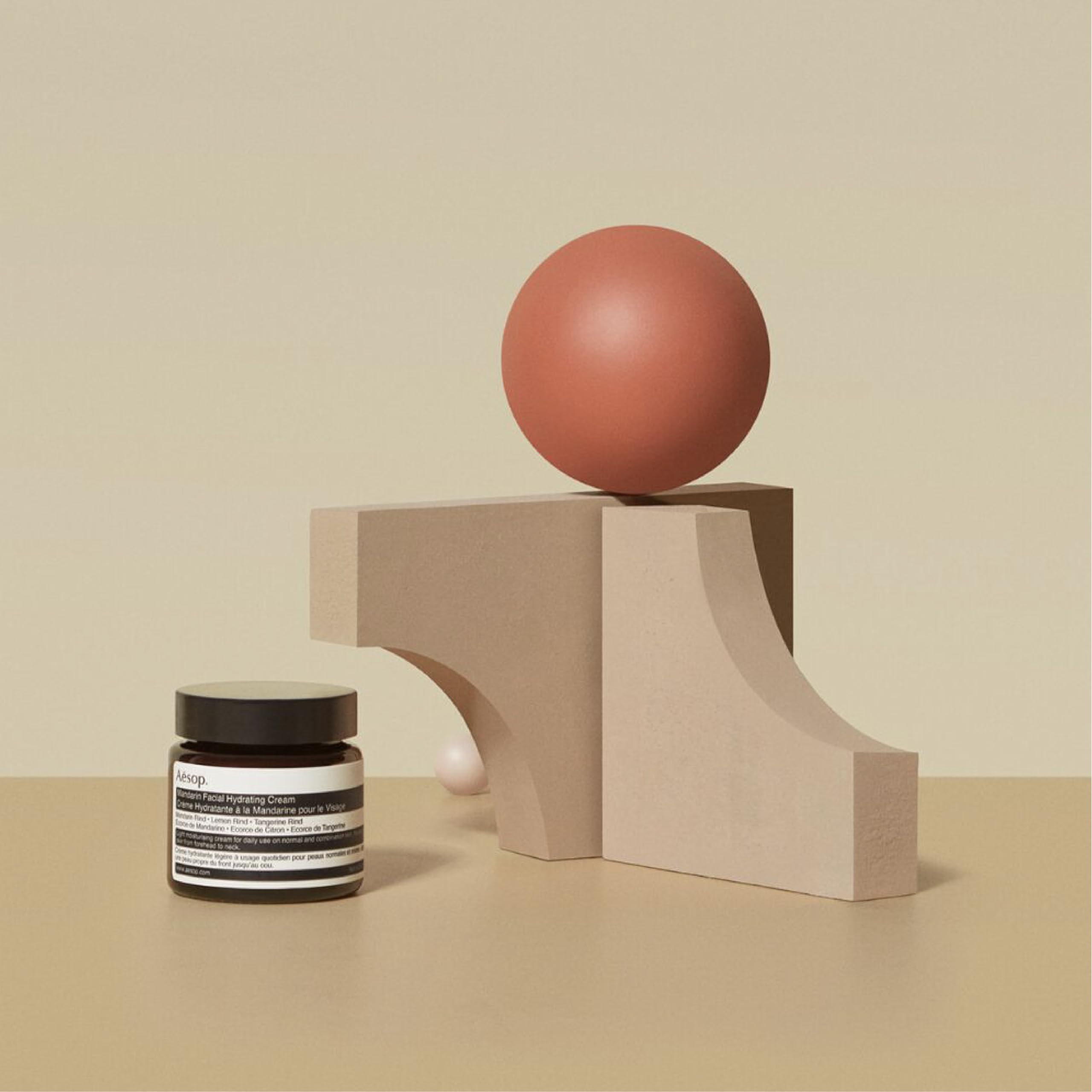 Aesop Mandarin Facial Hydrating Cream packaging, recyclable bottle emphasizing sustainability.