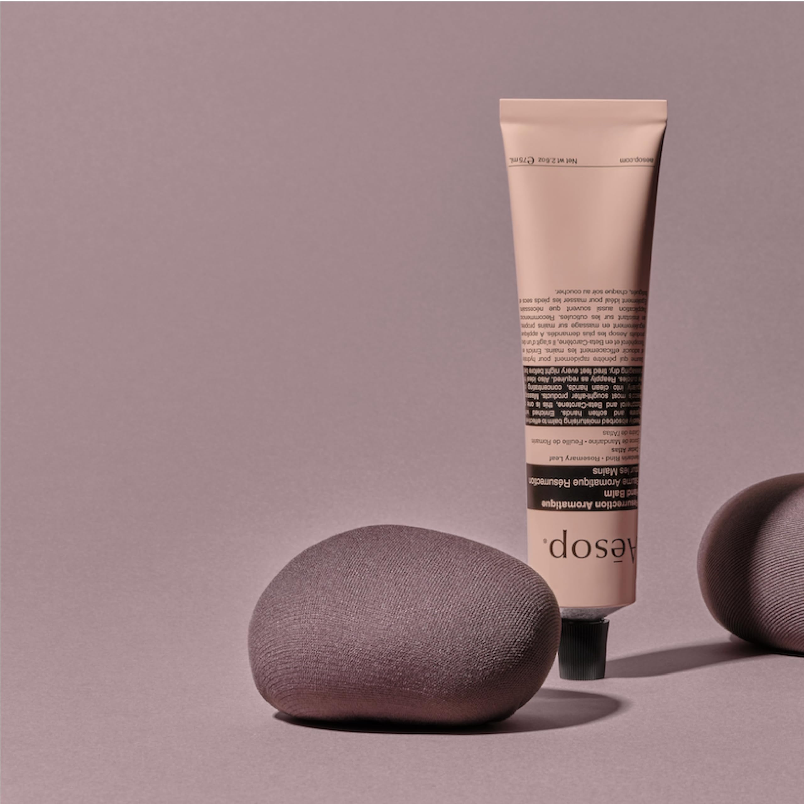 Aesop Resurrection Hand Balm packaging shows 100% recycled aluminum tube.