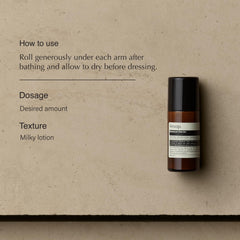 Person applying Aesop Roll-On Deodorant for quick, comfortable refreshment