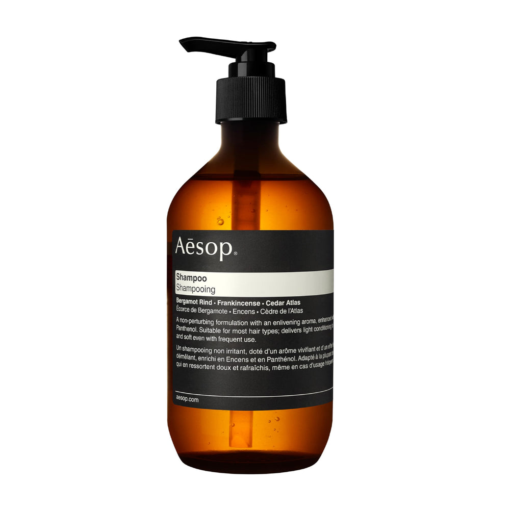 Aesop shampoo bottle with bergamot rind, showcasing cleansing action and citrus aroma.