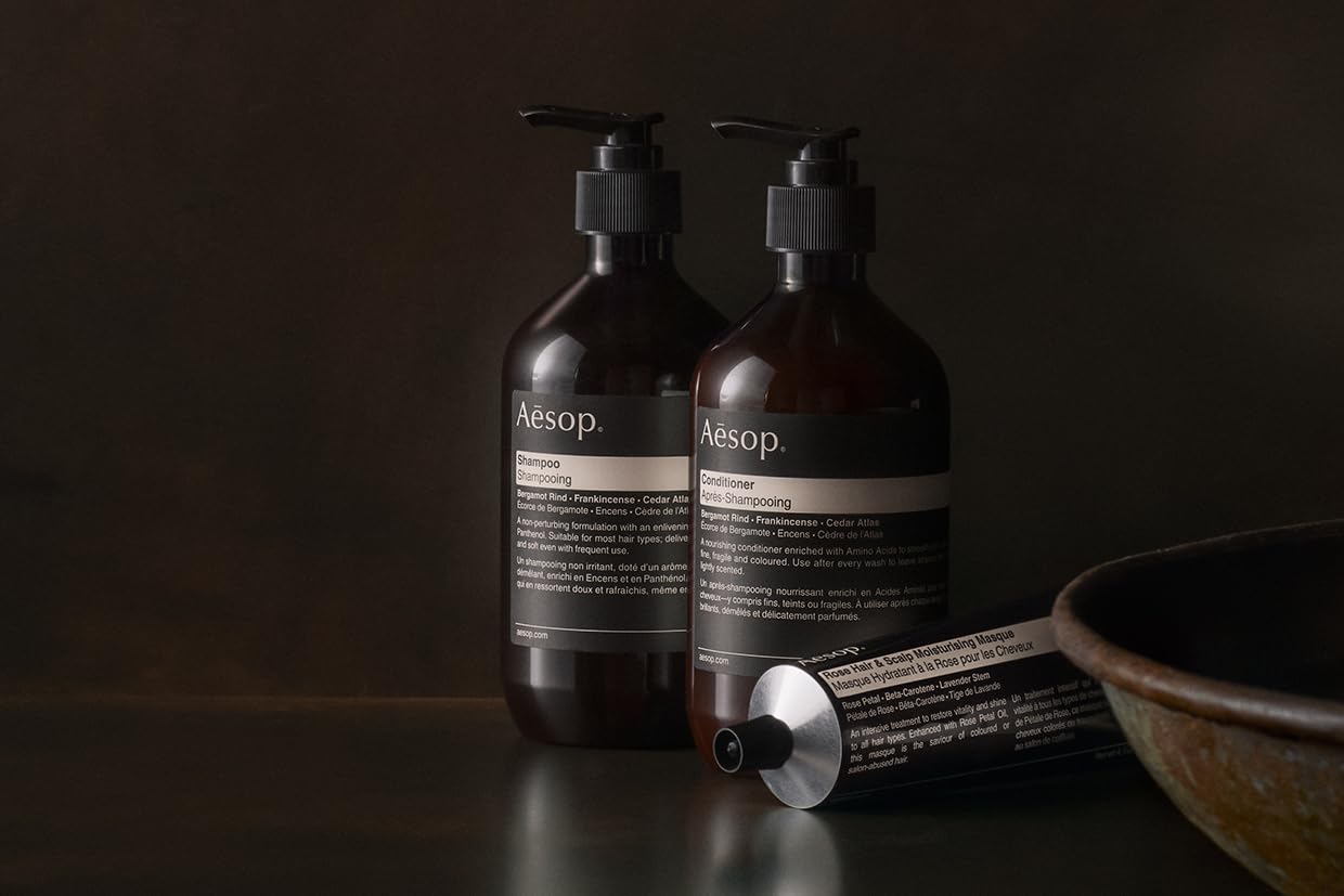 Aesop shampoo close-up showing rich lather for thorough washing.