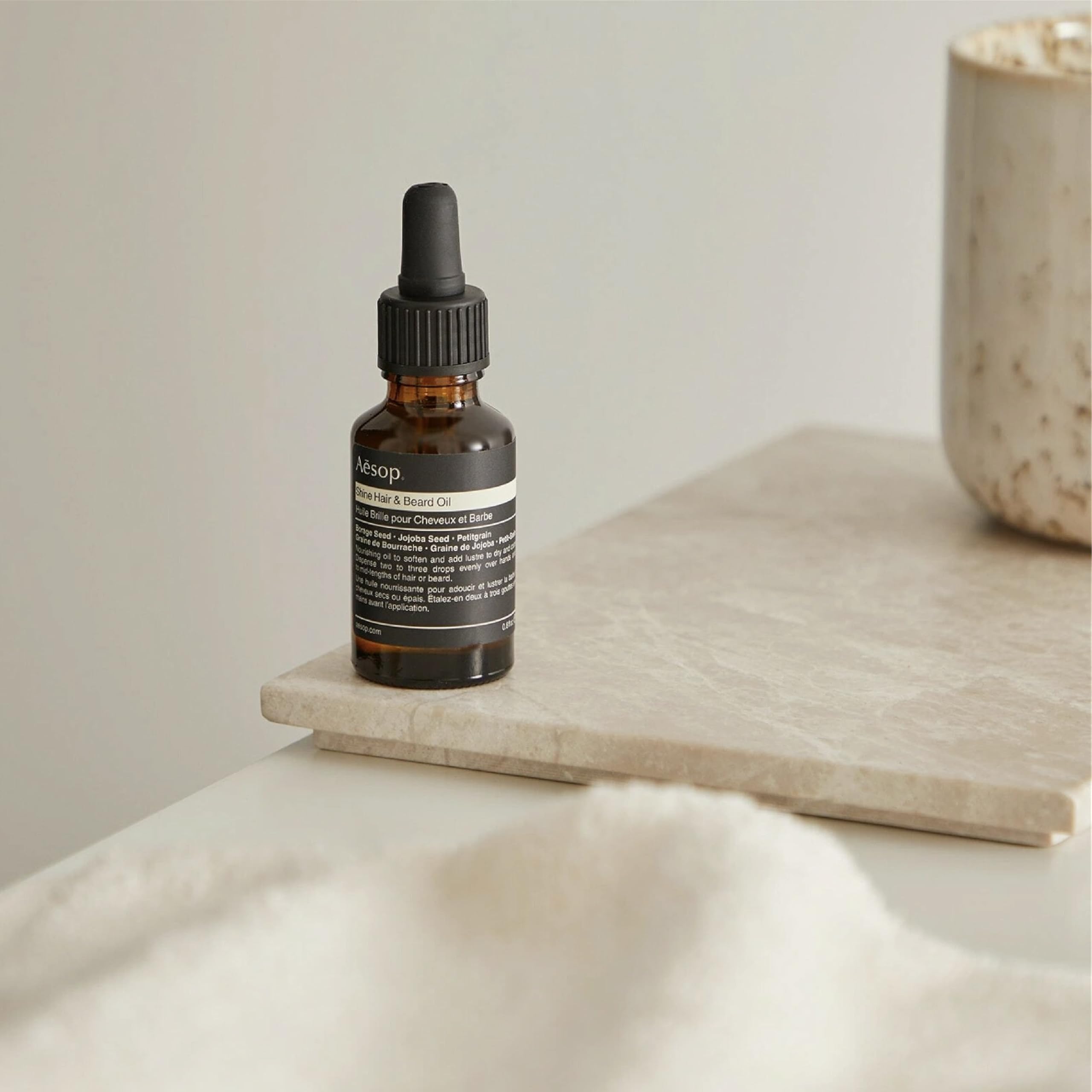Aesop Shine Oil on beard and hair delivers natural lustre without heaviness.