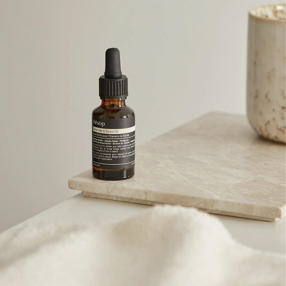 Aesop Shine Oil on beard and hair delivers natural lustre without heaviness.