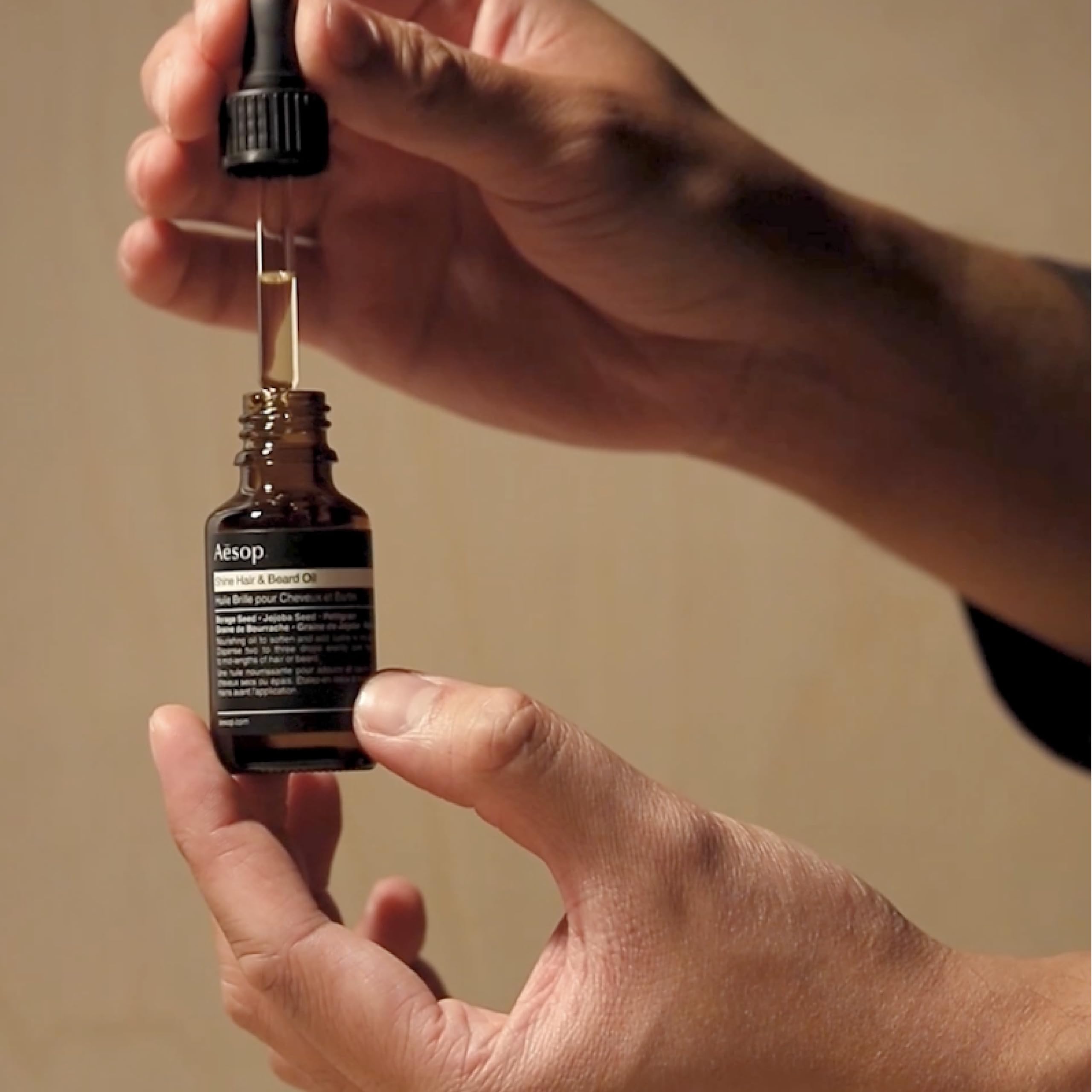 Aesop Shine Oil applied to hair ends reduces frizz and adds shine.