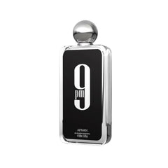 Afnan 9 PM for Men bottle top-notes bergamot close-up for a fresh opening.
