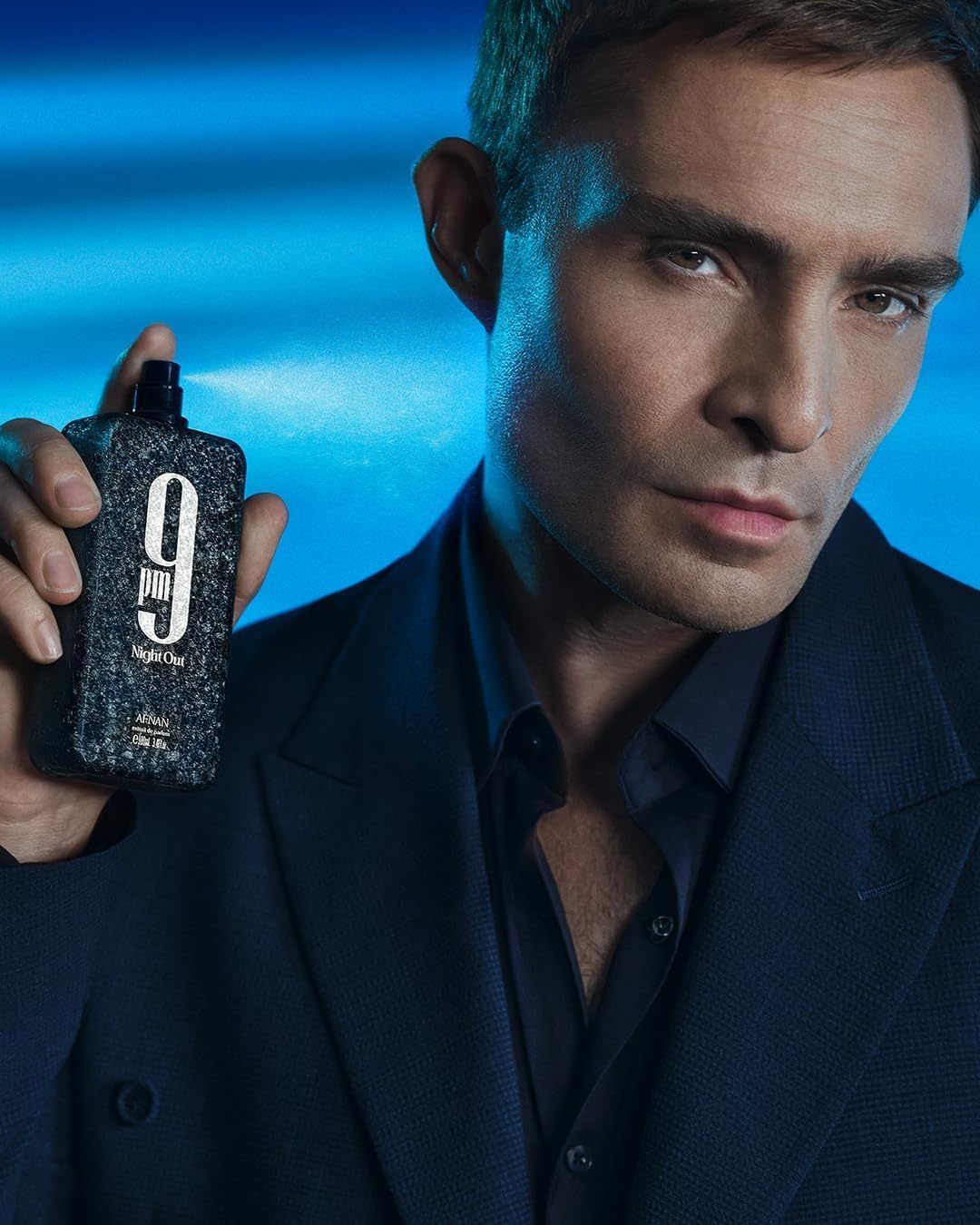 Afnan 9 PM Night Out on-skin application showing warmth and texture.