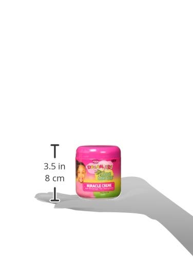 Dream Kids Olive Miracle Creme application on kids’ hair for smooth, manageable results.