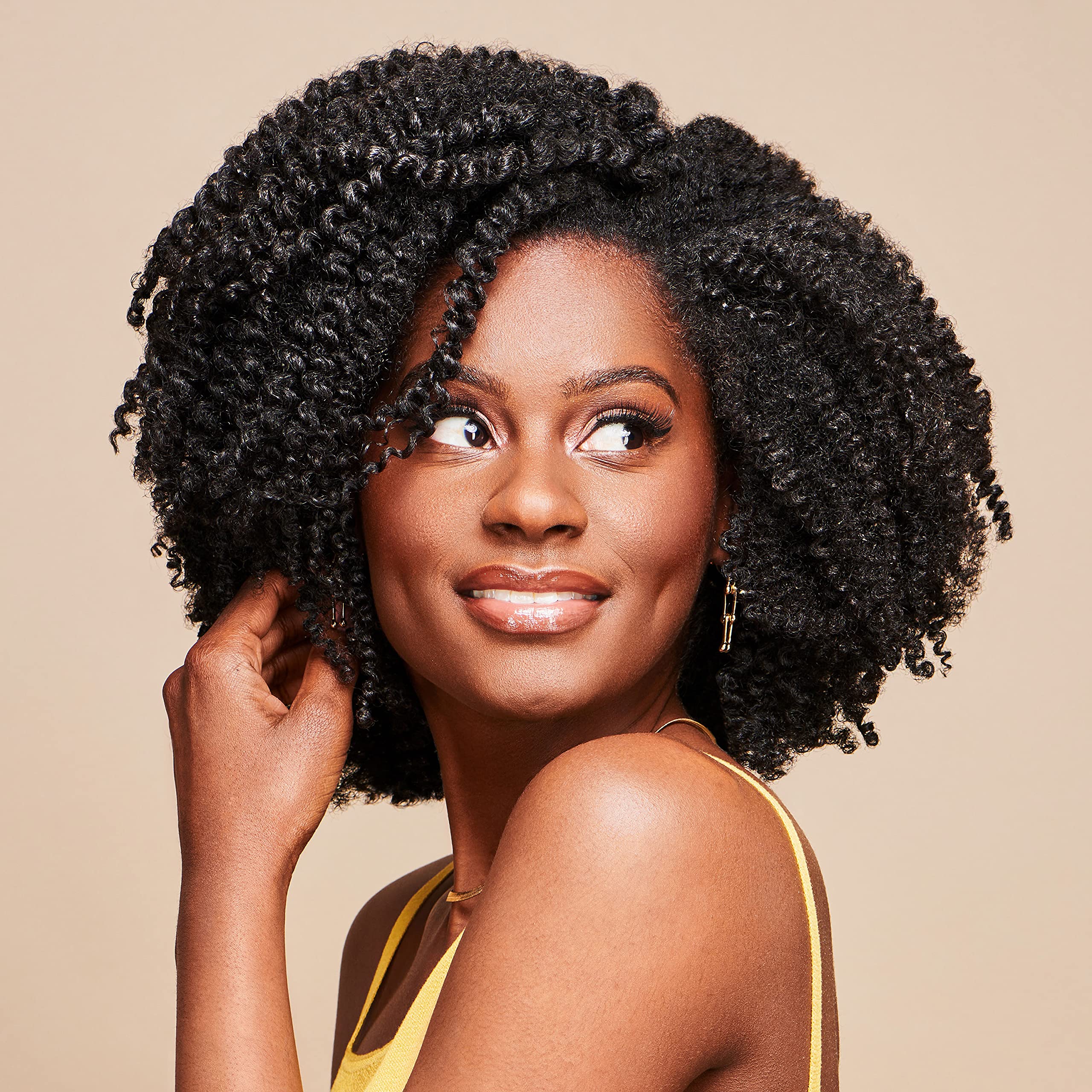 African Pride Moisture Miracle Leave-In application smoothing; helps tame frizz for easy styling