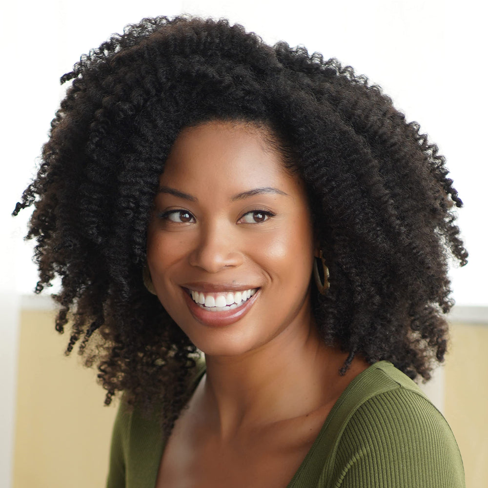 Product in use on curls prepping for wash day with African Pride