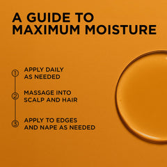 Scalp application of African Pride oil highlighting refreshing tea tree benefits.