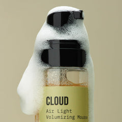 Applying AG Care Cloud Air Light Mousse for defined, frizz-free curls
