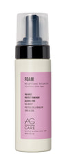 AG Care Foam Weightless Volumizer bottle on vanity for fuller-looking hair.