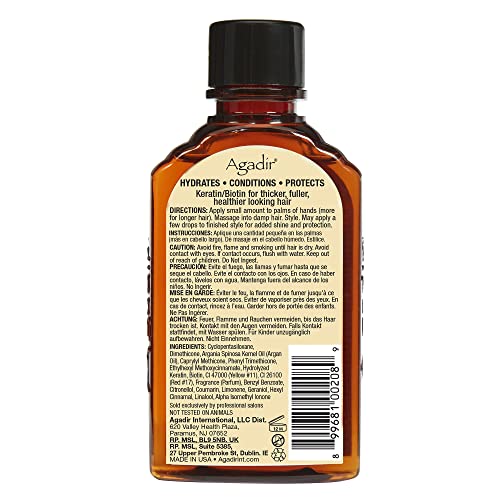 Agadir Argan Oil Hair Treatment golden liquid in bottle provides shine.