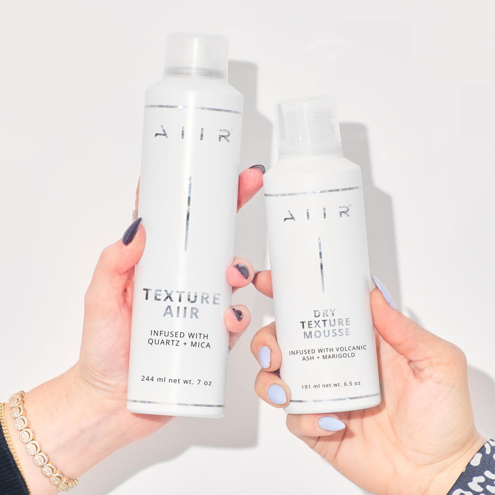 AIIR Dry Texture Mousse being applied to damp hair from roots to ends