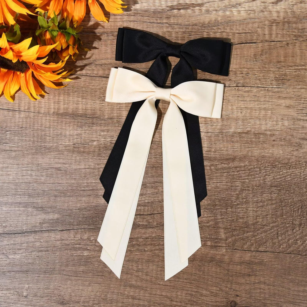 Aileam bows paired with outfits for toddlers to teens.