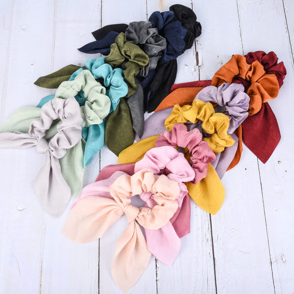 Aileam scrunchies seda rosa con lazo, ideal para coletas cómodas.