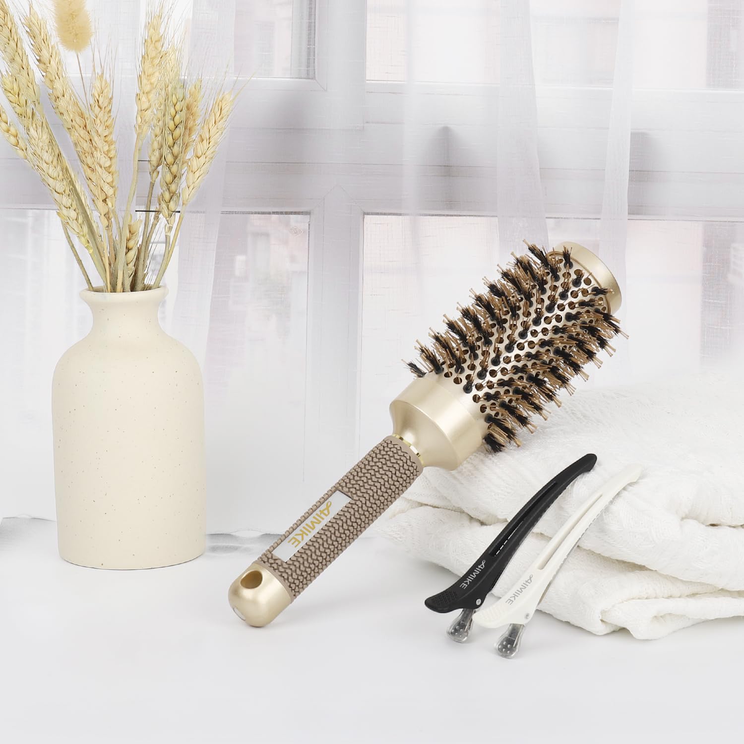 AIMIKE round brush helps reduce frizz and seal cuticles for smoother results