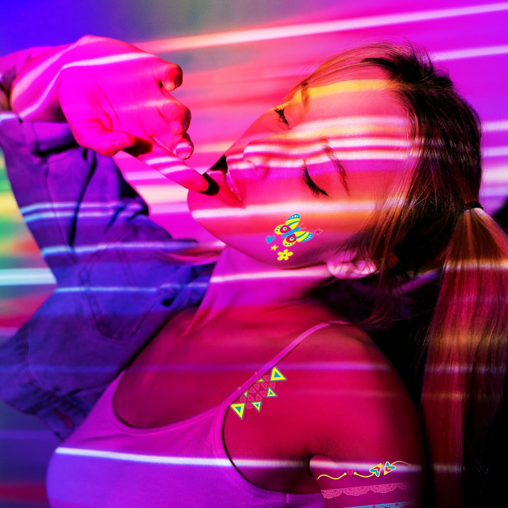 AirNOGO butterflies and feathers tattoos pop under neon glow for parties.