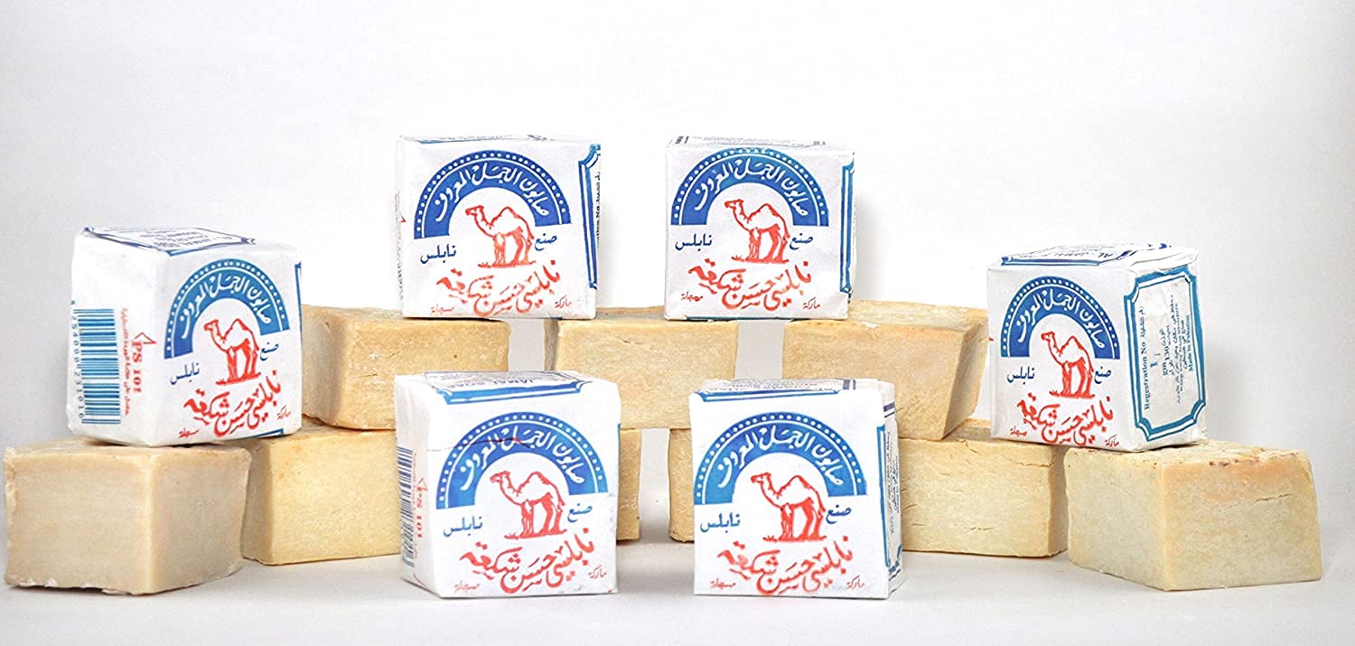 Al-Jamal olive oil soap bar close-up reveals organic texture ideal for daily use.