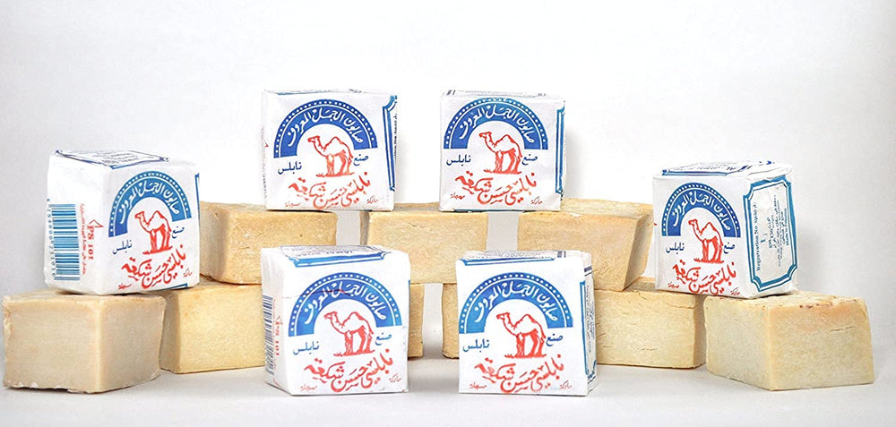 Al-Jamal olive oil soap bar close-up reveals organic texture ideal for daily use.