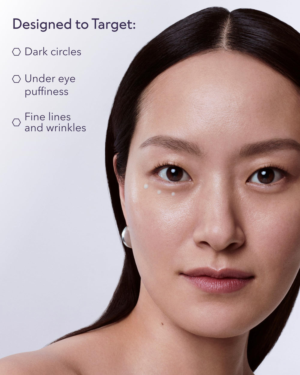 ALASTIN Restorative Eye Complex application shot around the eye contour, showing a gentle dab.