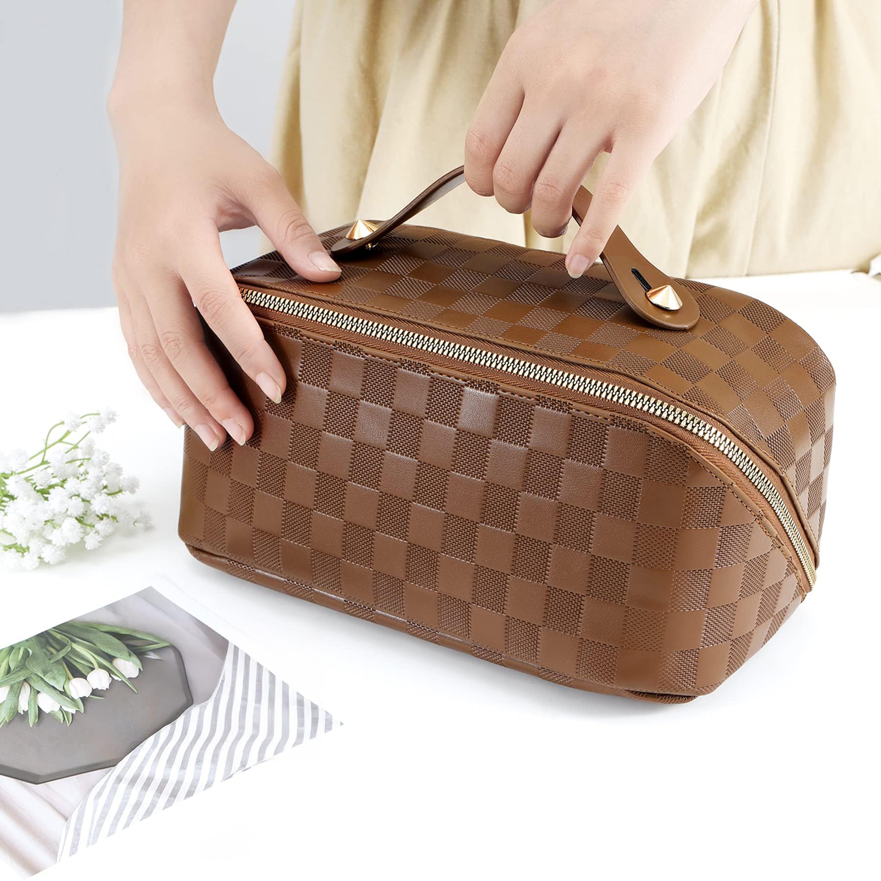 ALEXTINA side pockets hold lipsticks and small travel essentials.