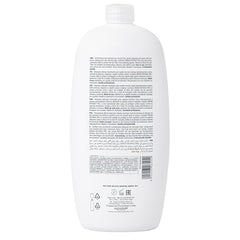 ALFAPARF Milano Semi di Lino Diamond shampoo being poured for cleansing.