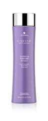 Alterna Caviar Anti-Aging Multiplying Volume Shampoo bottle pours, signaling an instant volume boost.