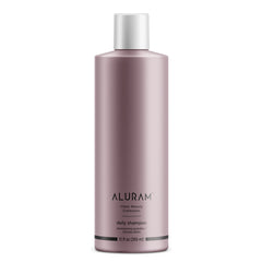 ALURAM Coconut Water Daily Shampoo bottle closeup for hydration and shine.